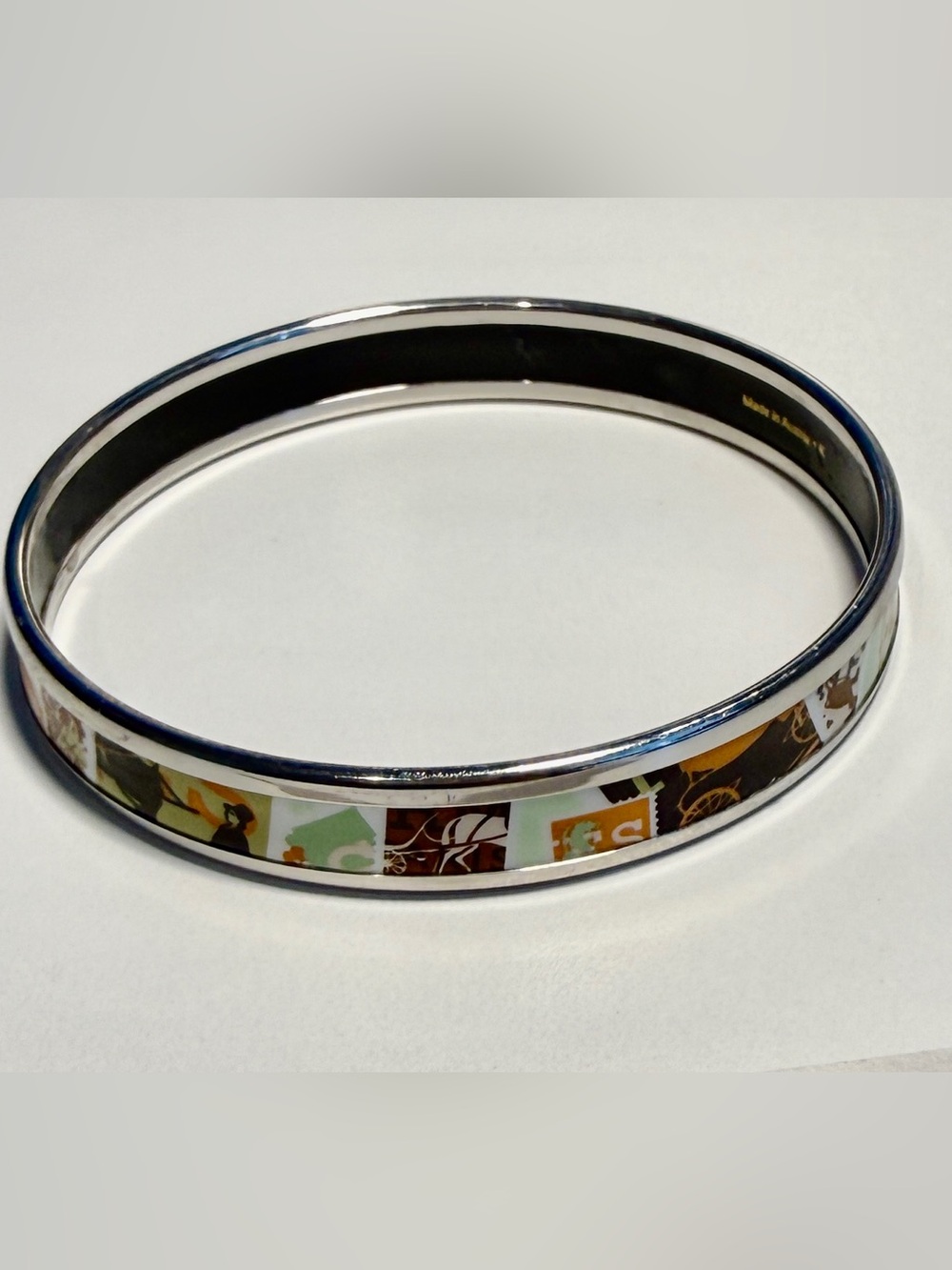 Hermes enamel thin printed de passage to Paris bangle. Silver edge